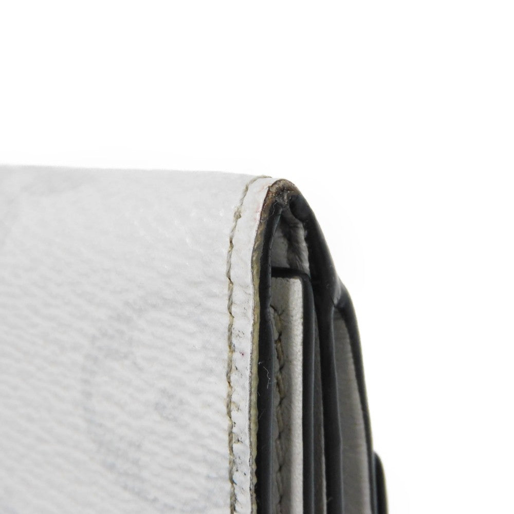 LOUIS VUITTON Tri-fold wallet M67621 Taiga leather x monogram canvas x smooth leather Antarctica Taiga Lama Monogram Discovery compact wallet