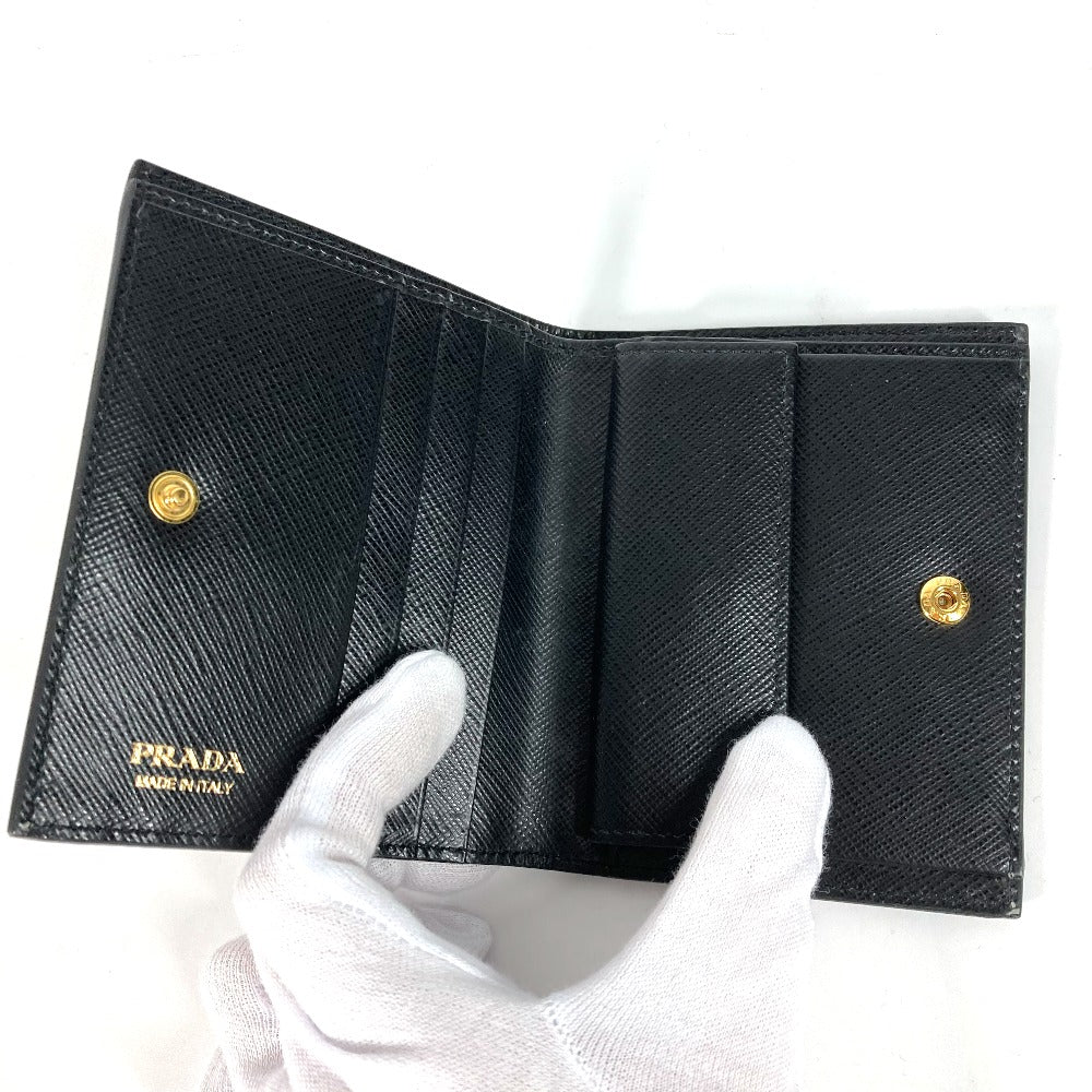 PRADA Folded wallet 1MV204 leather black All-over logo