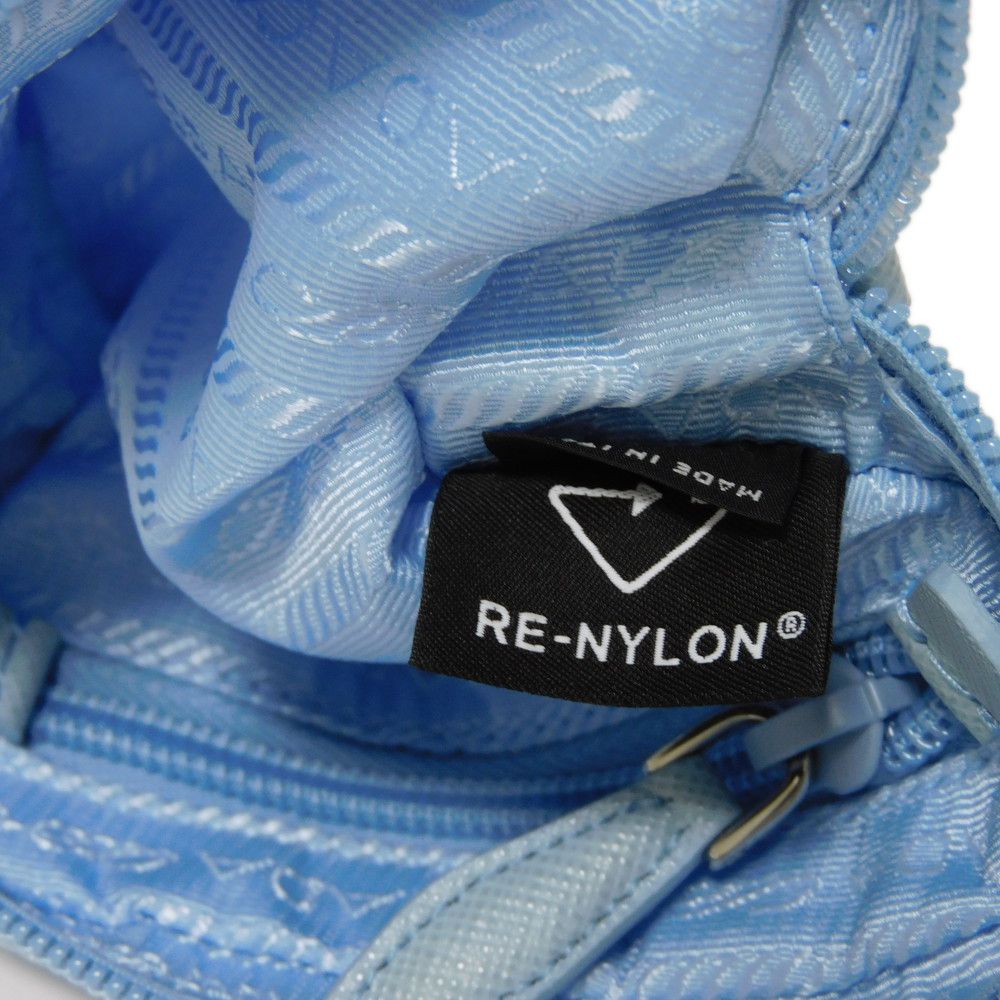 PRADA Clutch bag 1ND339 R067 F0076 recycled polyamide Light blue Triangle logo Micro Re-Nylon Pouch