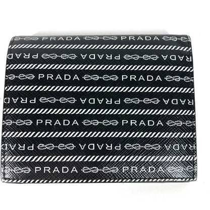 PRADA Folded wallet 1MV204 leather black All-over logo